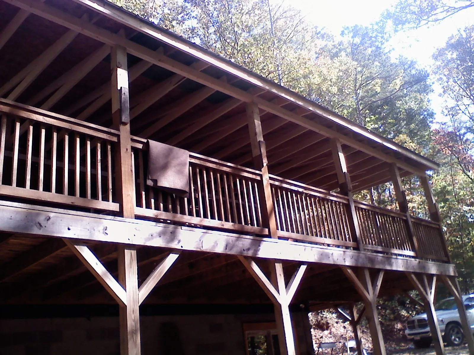 Timber framing under a new elevated porch and deck — Roof Leak Repair in Michigan Center by Roofing Brothers